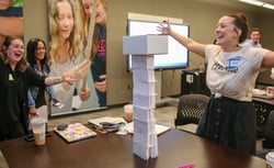 Educators participating in hands-on training; tower of power unit