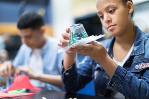 Young teen girl engineering a model antiviral 