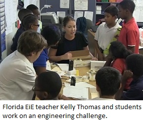 Florida EiE teacher Kelly Thomas and students work on engineering a model maglev train