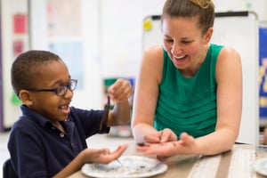 Kindergarten teacher engineering with young child