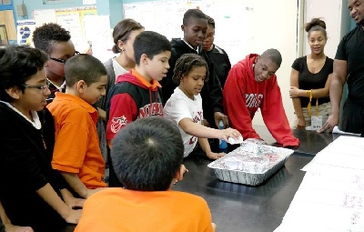 Simulating rain on a model city is one activity in the EE unit Don’t Runoff.